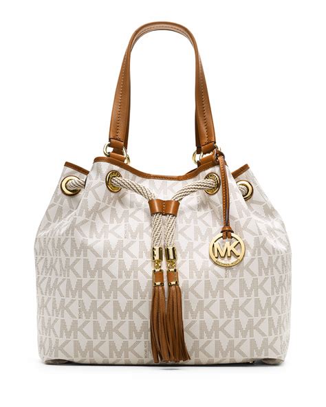 michael kors tan purse with tassles|Michael Kors beige purse.